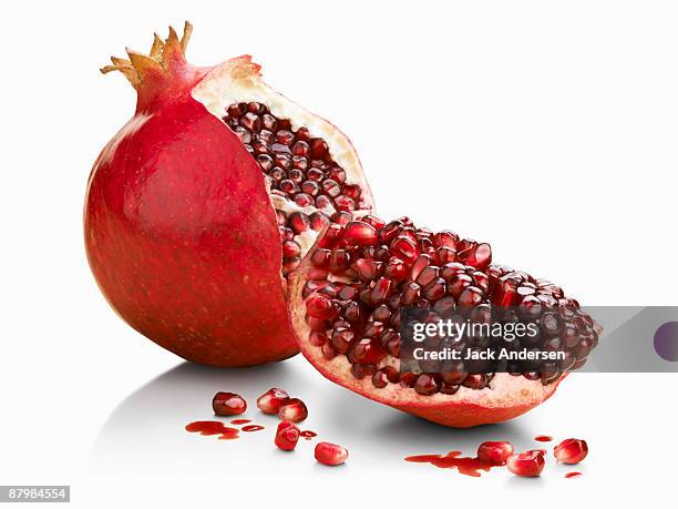 halved pomegranate - pomegranate stock pictures, royalty-free photos & images