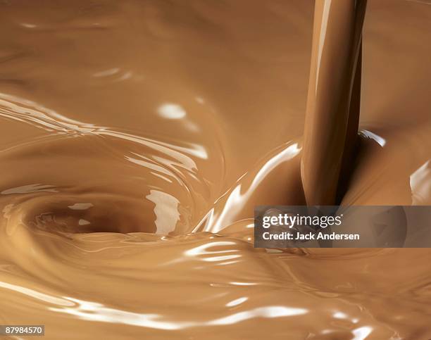 chocolate milk pour - nata fotografías e imágenes de stock