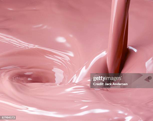 pink milk pour - strawberries and cream stock-fotos und bilder