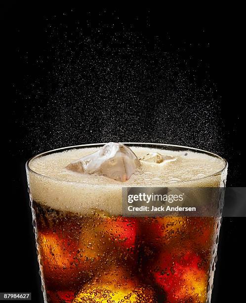 fizzy glass of cola - pepsi stock pictures, royalty-free photos & images