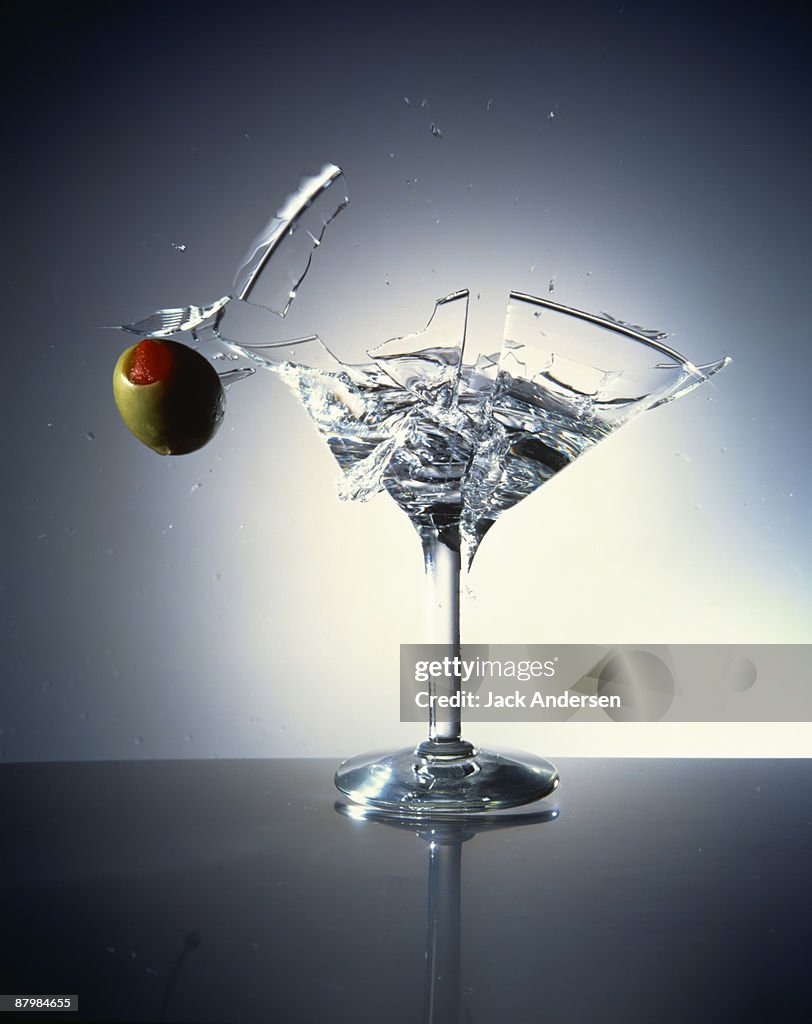 Olive shattering martini glass