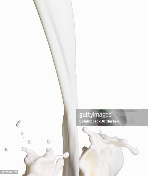 pouring milk - fülle stock-fotos und bilder