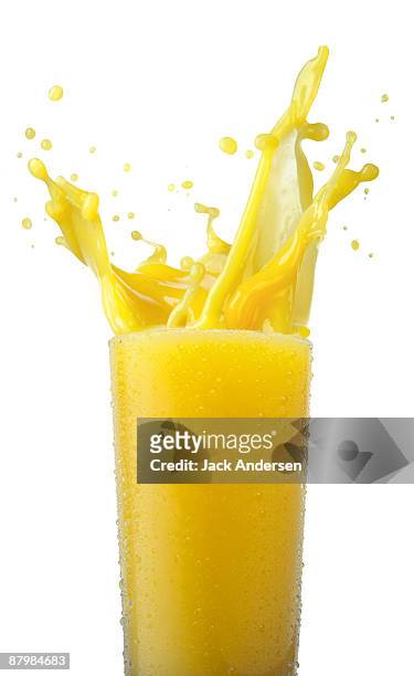 orange juice splashing - orange juice stock pictures, royalty-free photos & images