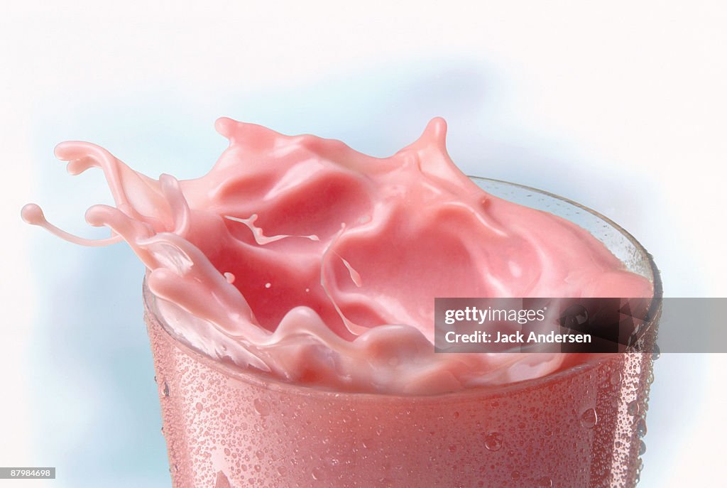 Splashing strawberry milk shake