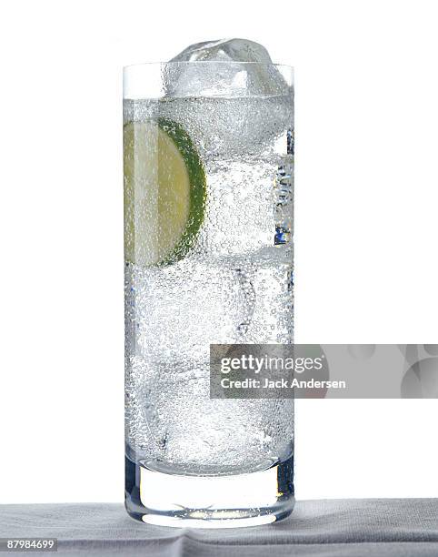 club soda with lime - glass of sparkling water with ice stock pictures, royalty-free photos & images