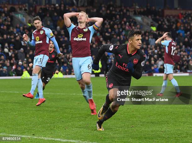 Alexis Sanchez celebrates scoring Arsenal's goal during the Premier League match between Burnley and Arsenal at Turf Moor on November 26, 2017 in...