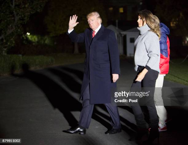 President Donald Trump, First Lady Melania Trump and their son Barron Trump return to the White House on November 26, 2017 in Washington, DC. The...