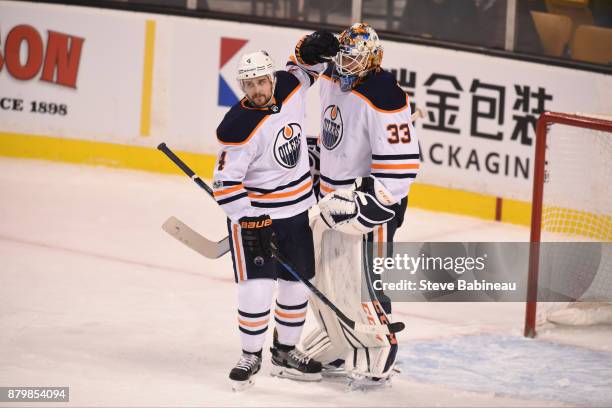 Kris Russell and Cam Talbot of the Edmonton Oilers celebrate a win against the Boston Bruins at the TD Garden on November 26, 2017 in Boston,...