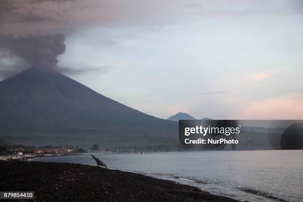 View of Mount Agung Volcano Erupted in the morning from Amed Beach. Mount Agung Volcano erupted with giving above 3000 meter of cloud that filled the...