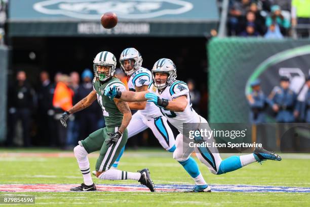 Carolina Panthers middle linebacker Luke Kuechly knocks the ball away on a pass intended for New York Jets wide receiver Robby Anderson during the...