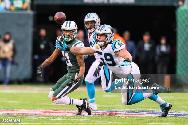 Carolina Panthers middle linebacker Luke Kuechly knocks the ball away on a pass intended for New York Jets wide receiver Robby Anderson during the...