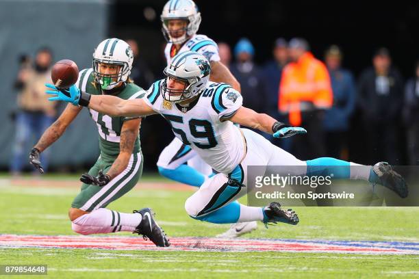 Carolina Panthers middle linebacker Luke Kuechly knocks the ball away on a pass intended for New York Jets wide receiver Robby Anderson during the...