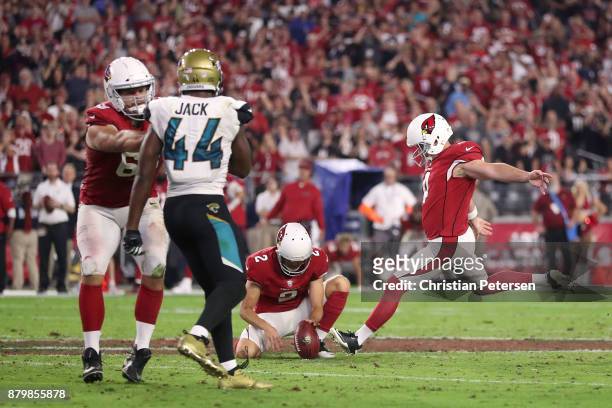 Phil Dawson of the Arizona Cardinals kicks a 57 yard game winning field goal against the Jacksonville Jaguars in the second half at University of...