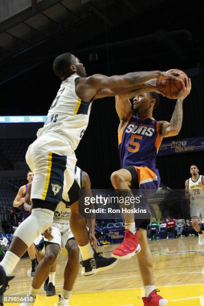 Tra-Deon Hollins of the Fort Wayne Mad Ants battles Josh Gray of the Northern Arizona Suns during their NBDL game at Memorial Coliseum on November...