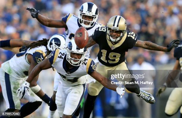 Mark Barron, Blake Countess, and Lamarcus Joyner of the Los Angeles Rams dive for a loose ball intended for Ted Ginn of the New Orleans Saints during...