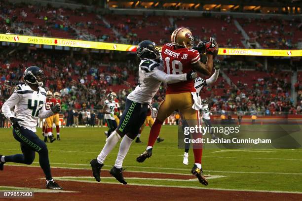 Louis Murphy of the San Francisco 49ers catches a touchdown pass thrown by Jimmy Garoppolo of the San Francisco 49ers against the Seattle Seahawks at...