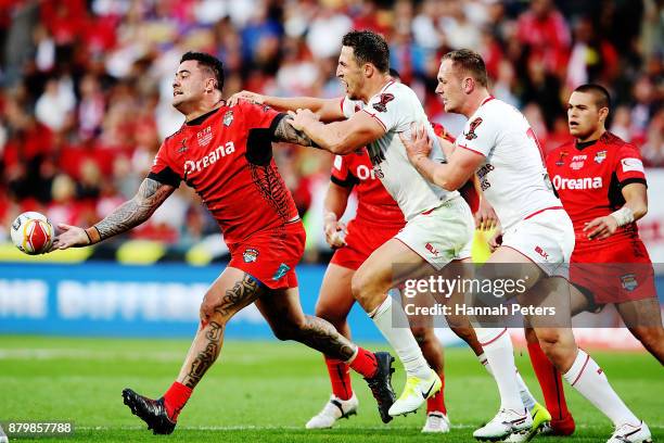 Andrew Fifita of Tonga offloads the ball during the 2017 Rugby League World Cup Semi Final match between Tonga and England at Mt Smart Stadium on...