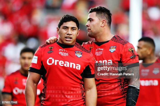 Andrew Fifita and Jason Taumalolo of Tonga embrace during the 2017 Rugby League World Cup Semi Final match between Tonga and England at Mt Smart...