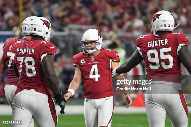 Phil Dawson of the Arizona Cardinals is congratulated by teammates after scoring a 48 yard touchdown in the second half at University of Phoenix...