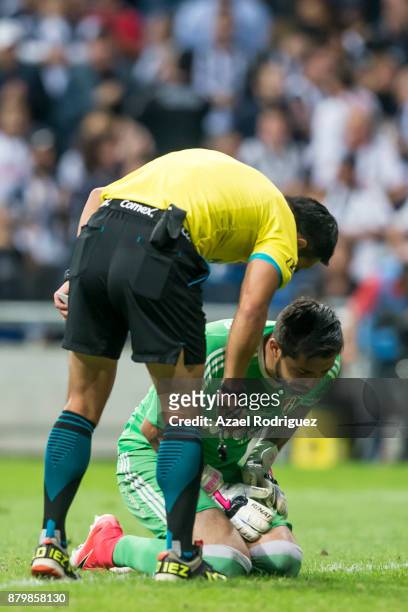 Miguel Angel Fraga, goalkeeper of Atlas is assisted after being injuried during the quarter finals second leg match between Tigres UANL and Leon as...