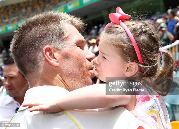 David Warner of Australia kisses his daughter Ivy after Australia hit the winning runs during day five of the First Test Match of the 2017/18 Ashes...