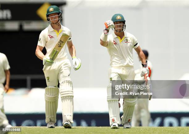 Cameron Bancroft and David Warner of Australia celebrate after hitting the winning runs during day five of the First Test Match of the 2017/18 Ashes...