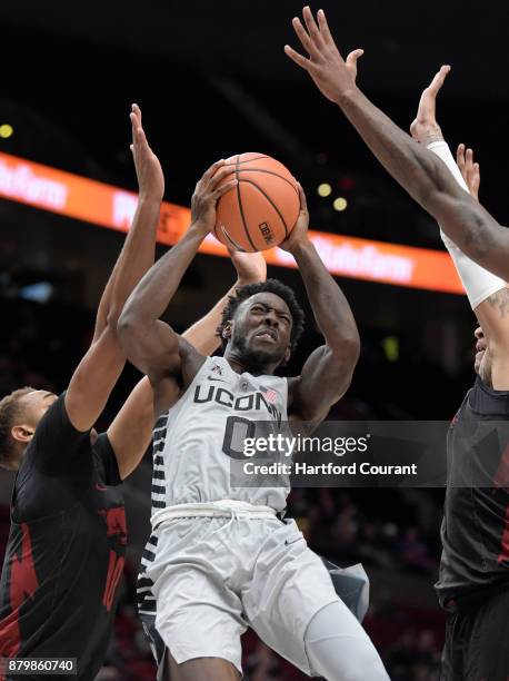 Connecticut Huskies guard Antwoine Anderson feels the pressure and is fouled but managed to score and convert on the 3 point play during second half...