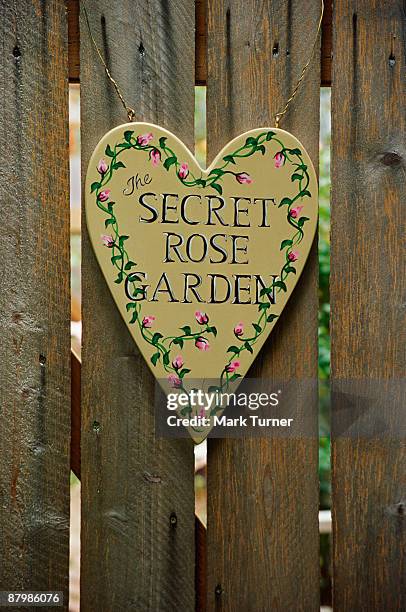 heart-shaped sign on wooden gate - garden gate rose stock pictures, royalty-free photos & images