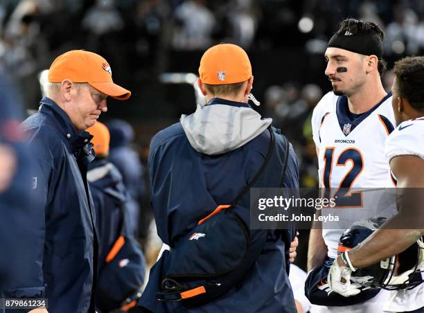 Denver Broncos offensive coordinator Bill Musgrave and Denver Broncos quarterback Paxton Lynch stand on the sideline stunned as time runs out on...