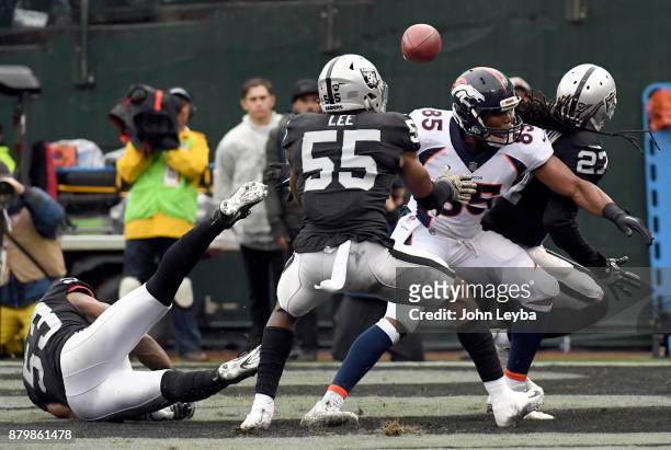 Denver Broncos tight end Virgil Green can't hold on to a pas sin the end zone as the ball bounces up and gets intercepted by Oakland Raiders middle...