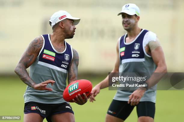 Bradley Hill of the Dockers looks to handball to Stephen Hill during a Fremantle Dockers AFL pre-season training session at Victor George Kailis Oval...