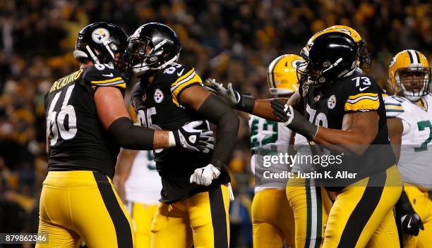 Xavier Grimble of the Pittsburgh Steelers celebrates with David DeCastro after a 1 yard touchdown reception in the first quarter during the game at...