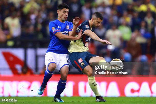 Francisco Silva of Cruz Azul struggles for the ball with Guido Rodriguez of America during the quarter finals second leg match between America and...