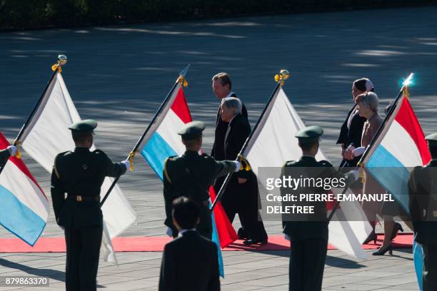Luxembourg Grand Duke Henri ) and Princess Alexandra are escorted by Japanese Emperor Akihito and Empress Michiko during the welcoming ceremony at...