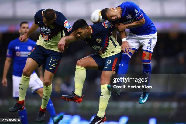 Julio Cesar Dominguez of Cruz Azul struggles for the ball with Pablo Aguilar and Silvio Romero of America during the quarter finals second leg match...