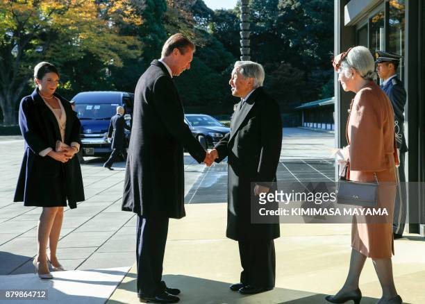 Luxembourg's Grand Duke Henri is welcomed by Japan's Emperor Akihito upon his arrival at the Imperial Palace in Tokyo on November 27, 2017 as...