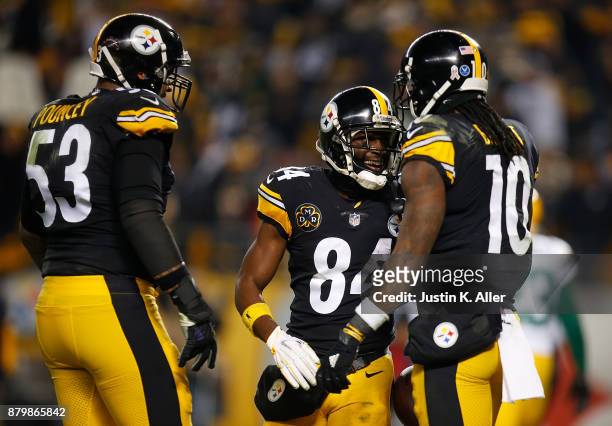 Antonio Brown of the Pittsburgh Steelers celebrates with Martavis Bryant and Maurkice Pouncey after a catch for a two point conversion in the second...