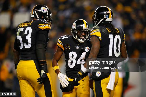 Antonio Brown of the Pittsburgh Steelers celebrates with Martavis Bryant and Maurkice Pouncey after a catch for a two point conversion in the second...