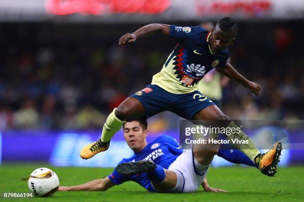 Darwin Quintero of America struggles for the ball with Francisco Silva of Cruz Azul during the quarter finals second leg match between America and...