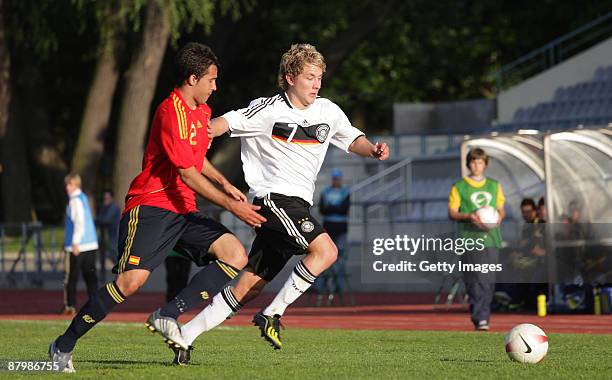Lewis Holtby of Germany battles for the ball during the U19 Euro Qualifier match between Spain and Germany at the A Le Coq Arena on May 26, 2009 in...