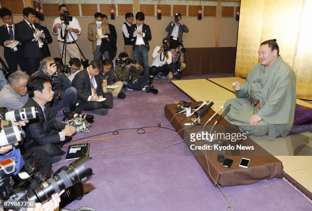 Sumo grand champion Hakuho speaks during a press conference in Fukuoka on Nov. 27 a day after the final day of the Kyushu Grand Sumo Tournament,...