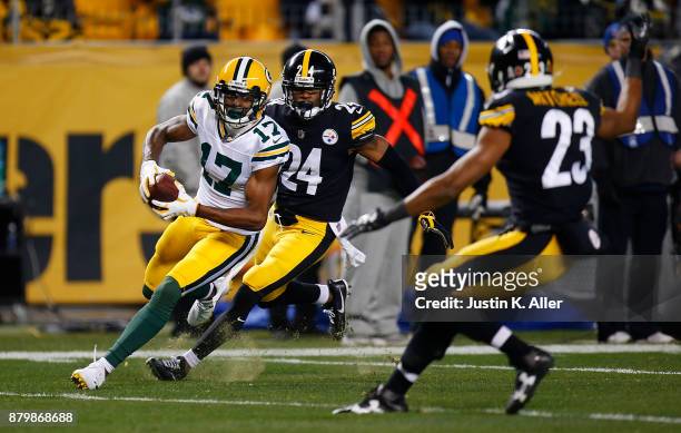 Davante Adams of the Green Bay Packers runs upfield after a catch for a 55 yard touchdown reception in the third quarter during the game against the...