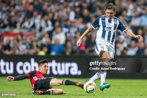 Neri Cardozo of Monterrey fights for the ball with Bryan Garnica of Atlas during the quarter finals second leg match between Tigres UANL and Leon as...