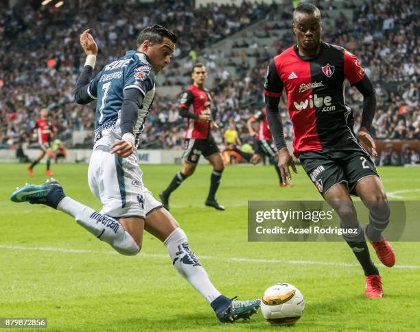 Rogelio Funes Mori of Monterrey fights for the ball with Jaine Barreiro of Atlas during the quarter finals second leg match between Tigres UANL and...