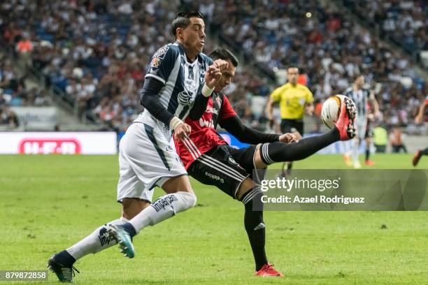 Rogelio Funes Mori of Monterrey fights for the ball with Daniel Arreola of Atlas during the quarter finals second leg match between Tigres UANL and...