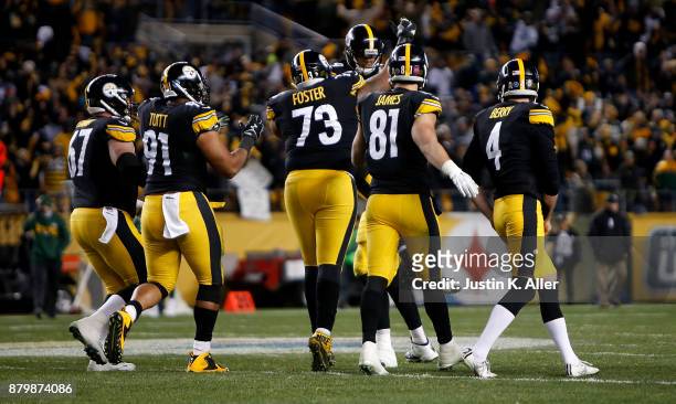Members of the Pittsburgh Steelers celebrate the game winning field goal by Chris Boswell that gave them a 31-28 win over the Green Bay Packers...