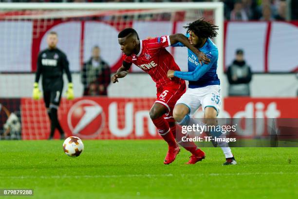 Jhon Cordoba of Cologne and Mohamed Elneny of Arsenal battle for the ball during the UEFA Europa League Group H soccer match between 1.FC Cologne and...