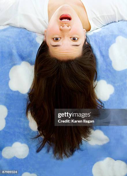 woman ""flying"" or ""falling"" upside down - upside down stock pictures, royalty-free photos & images