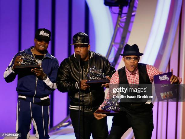 Ronnie DeVoe, Michael Bivins, and Ricky Bell of Bell Biv DeVoe accept the Soul Train Certified Award onstage at the 2017 Soul Train Awards, presented...