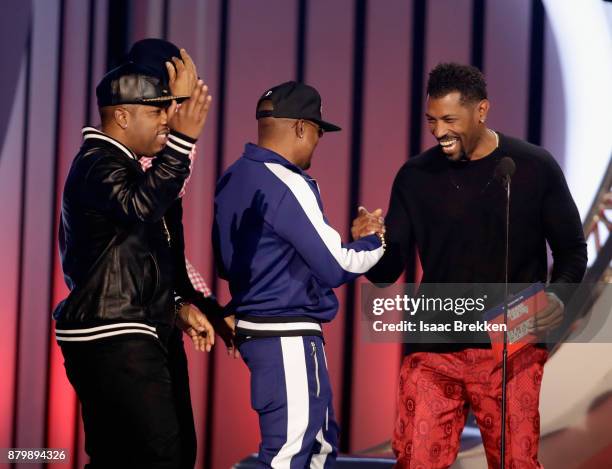 Michael Bivins, and Ronnie DeVoe of Bell Biv DeVoe accept the Soul Train Certified Award from Deon Cole onstage at the 2017 Soul Train Awards,...